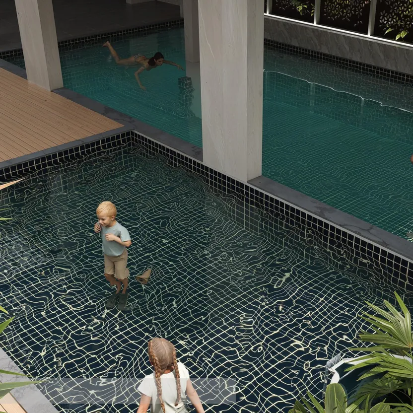 A shallow kids’ pool beside the main pool at The Ninth by Amberstone