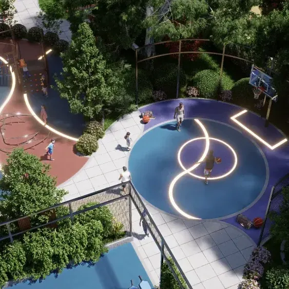 A circular sports court with lit markings among gardens at Amberstone Vectra