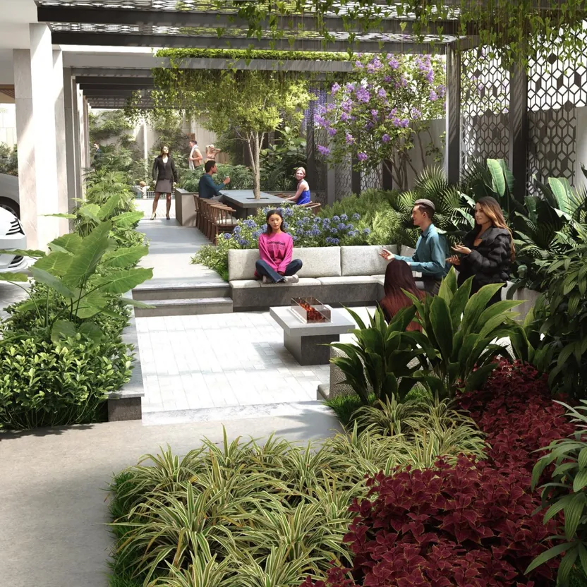 A planted courtyard with seating under pergolas at The Ninth by Amberstone